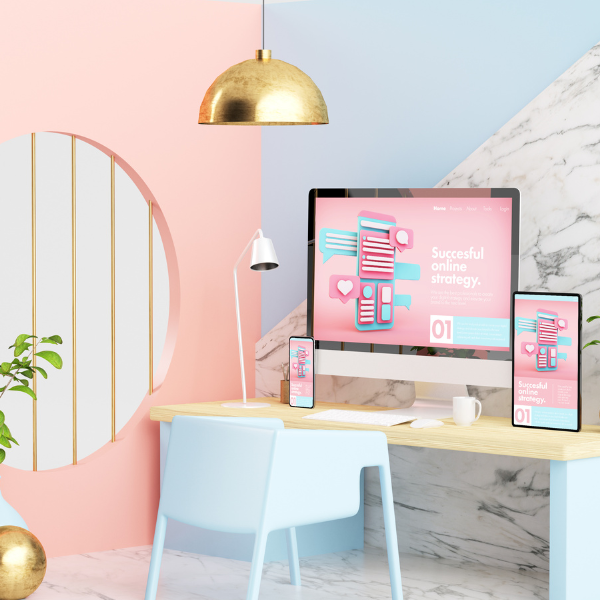 a 3D rendering of a blue-and-peach-themed office with a laptop, phone, and tablet showing the best Bigcomerce themes