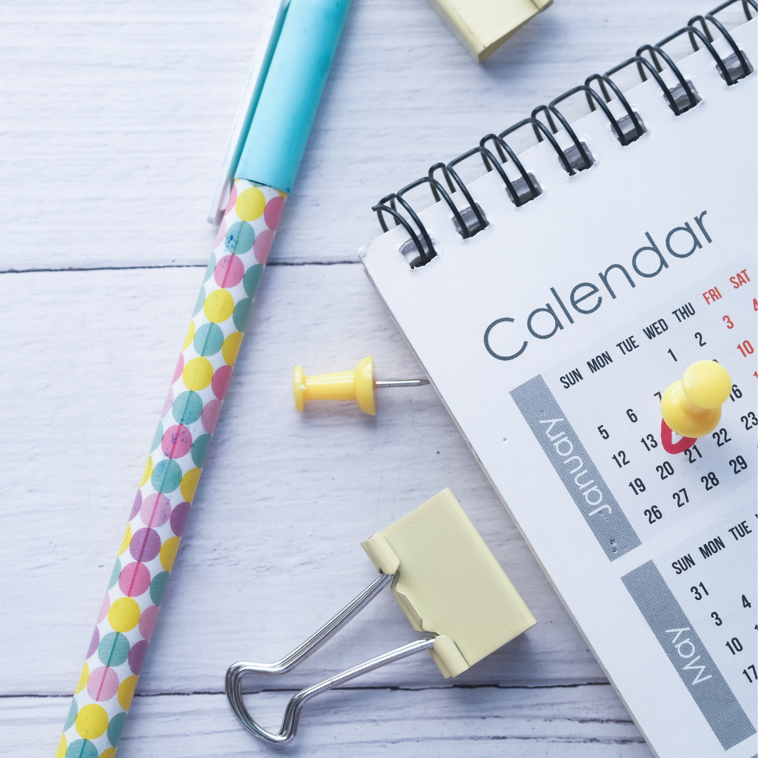 a colorful pen and a calendar with a pin through a date to symbolize the BigCommerce date picker