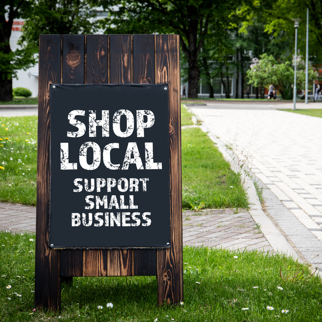 a shop local sign outdoors to symbolize the use of BigCommerce SEO in attracting local customers
