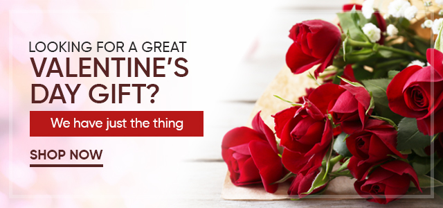 Valentine’s Day gift banner with red roses on a table and text promoting gifts; button reads “Shop Now.”