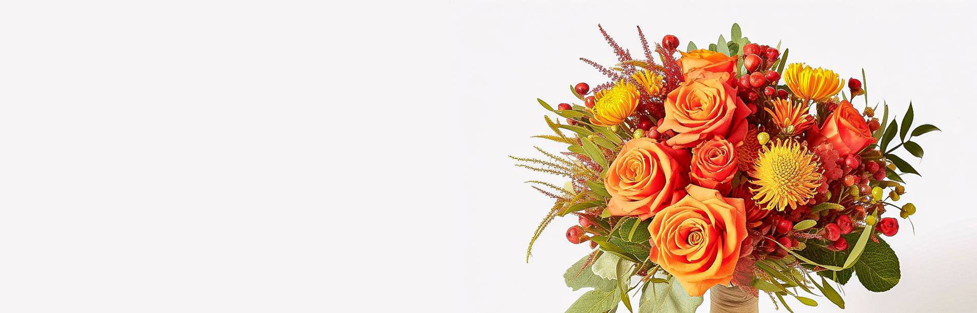 Nebula Beauty & Home banner featuring bright autumn bouquet of orange roses, yellow blooms, and red berries wrapped at the stems, displayed against a clean white backdrop.